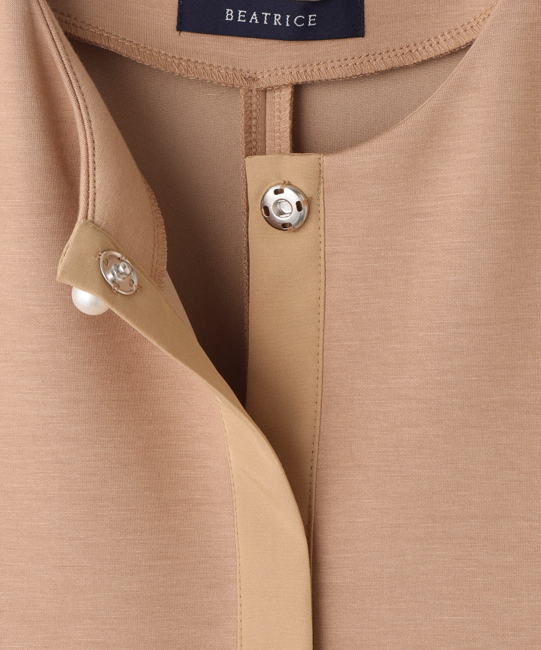 パール釦ペプラムベスト